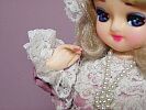 Doll with articulated fingers and painted nails