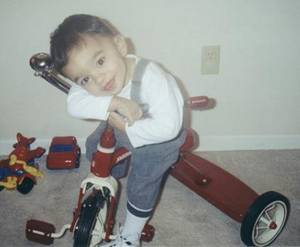 Joshua on his tricycle