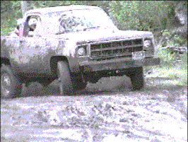 Clay's 1977 GMC Jimmy sliding around in mud