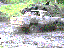 Clay's 1977 GMC Jimmy splashing though the mud