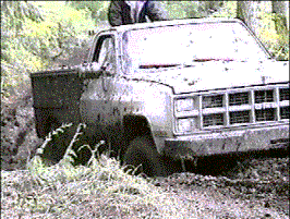 Our Neighbor Eddy's GMC in mud bog