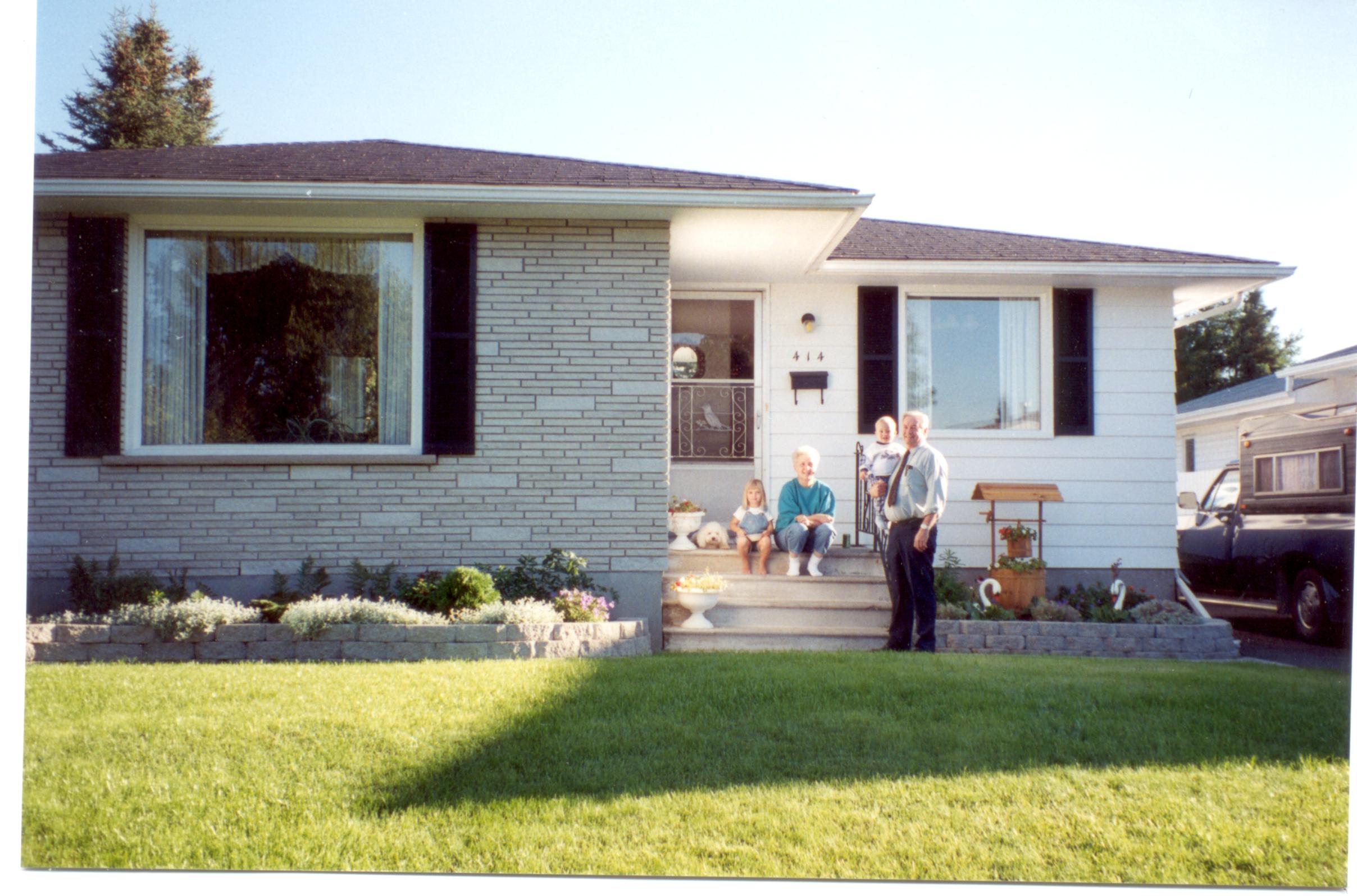 Ainsley,Anna,Ryan and Poppa , with Finnegan the dog,lying on the step. Sep 1997