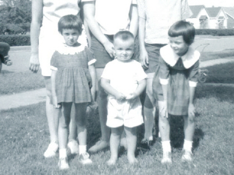 Our kids,Carolyn age 4,Rob age 2 and Donna age 6 in front yard at 152 E.Francis St. 1964