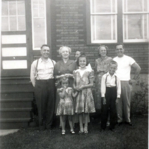 my wife Millie's family taken July 1951 (Millie center,first row, back row Rita,Gerald Perras,two on end of back row is Lena and Barney Perras, Millie's father and mother)