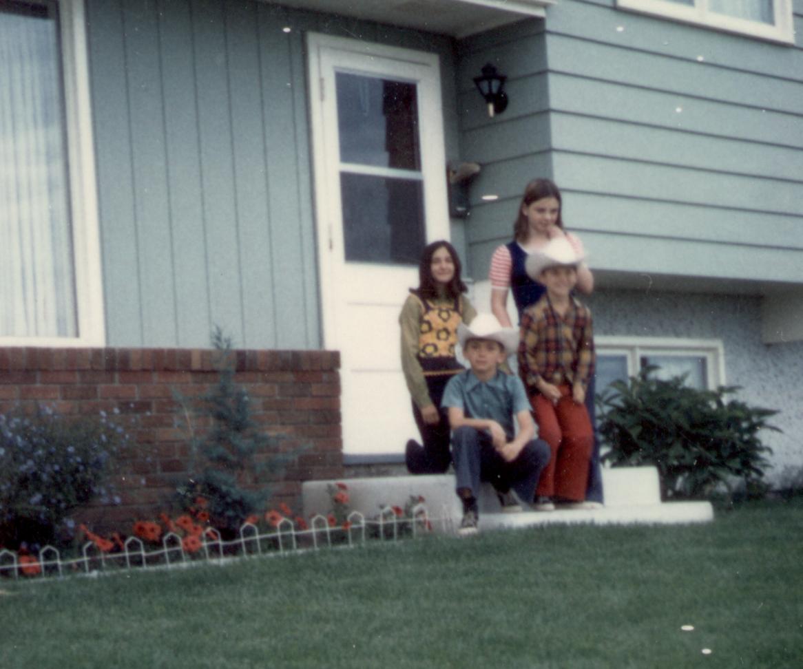 Donna,Carolyn(kneeling),Steve(standing),Rob,front yard of 203 Forest Rd. Calgary 1972...Stampede week