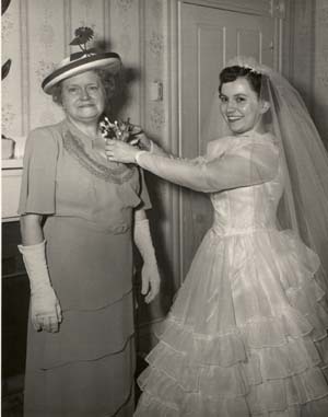 Dorothy pins corsage on Kate