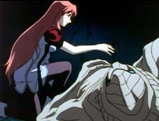 Elly kneels over a Wel, offering her blood to ease its pain.