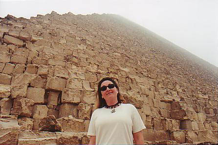 Donna standing right up against the Great Pyramid of Khufu on the Giza Plateau in Egypt