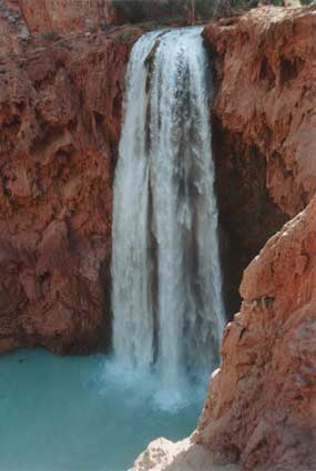 Mooney Falls, the most sacred of the Havasupai waterfalls, plunges 196 feet into an azure pool surrounded by veiled travertine cliffs.  The falls was named after James Mooney, who sought to be the first to pass this formidable boundary after being told by the Indians that only birds and the spirits of the dead had gone past the point.  He fell to his death, and several years later was found at the bottom, encased in travertine.