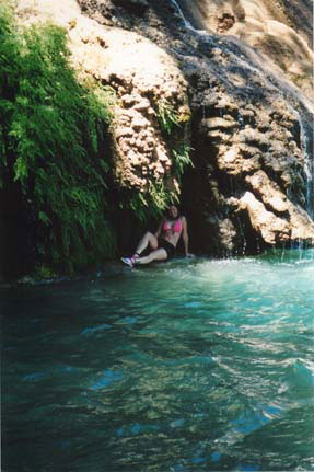 Here I am in a refreshing, cool grotto near Navajo Falls.  When the Indians diverted a portion of Havasu Creek some time ago, many previously unattainable areas were exposed, providing even more caves to explore.  (By the way, what WAS I thinking with that hot pink bikini?  Like, I'm not getting lost, or something?)