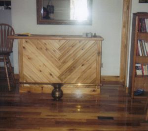 The top of this bar is hardwood flooring in herringbone pattern (like the front)