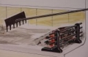 an ember rake banking embers up to the ember gate