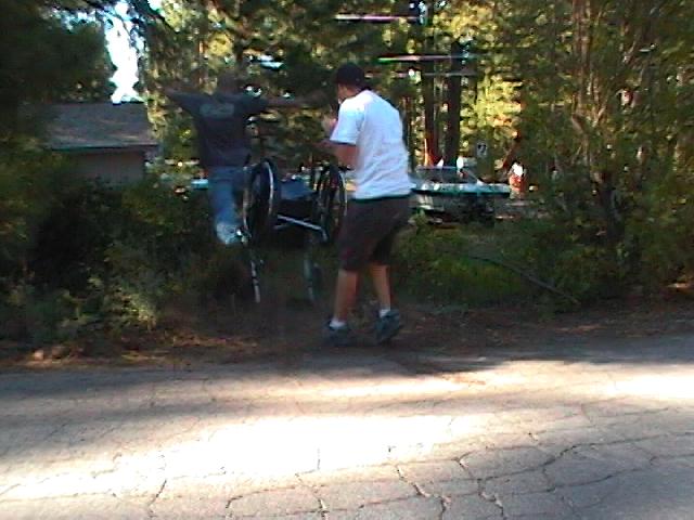 Jim gives Mike a little boost into the bushes