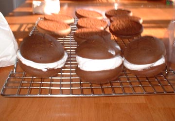 Whoopie Pies is a misnomer for these soft cookies filled with creamy frosting made with fresh egg whites. It was my husband's main reason for giving me Kitchen Aid Stand Mixer on our first Christmas together, and it was the first task he asked me to learn from his mom.