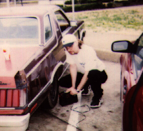 Tommy checking the air in our tires...