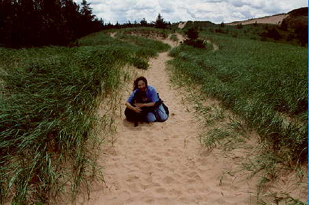 dragonfly and Sweetie dog in the Grand Sable dunes at Grand Marais, Michigan.