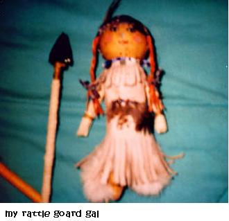 Rattle made of goard, leather, beads, fur, wood