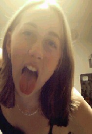 I don't know why her tongue is out. I think it was too wet and she was trying to dry it off. You should ask her.