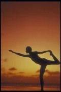 Silhouette of a Woman Stretching or Doing Yoga