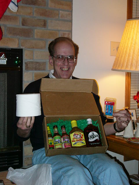 Neil is ready for the Hot Sauce gift that Shawn and Wendy gave him.