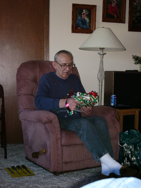 Dave unwraping a gift.