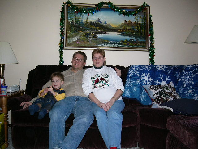 Michael, Phil, and Sue sitting on the couch.