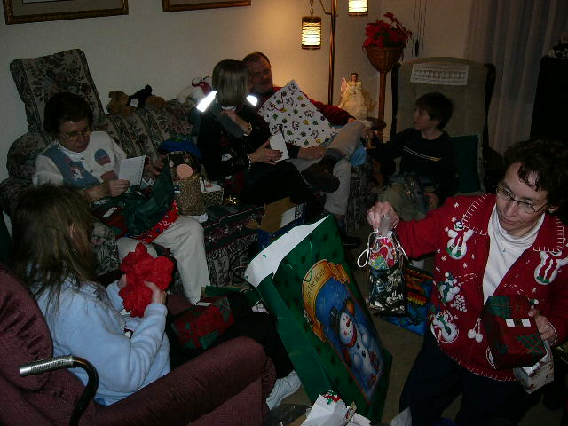 Christmas activites unfold.&nbsp; What's that around Lori's neck?
