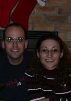 Shawn and Wendy sitting by the fireplace.