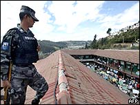 Policeman watches protests in a jail in Quito, Ecuador