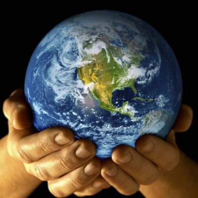 Human hands holding the world