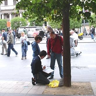 all_afternoon_a_steady_stream_of_people_some_alone_some_in_groups_stopped_to_sign
