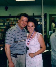 My dad and Amber at her 8th grade graduation.