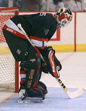 Rhodes sits dejectedly after letting in a goal.