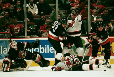 Scramble in front of the net.