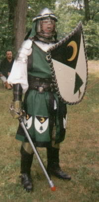 Aurthour in his armor and green fighter surcote