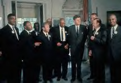 John F. Kennedy in the Oval Office with various civil rights activists including Martin Luther King (second from left).