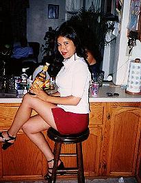My friend Patty holding a Jose Cuervo Tequila bottle