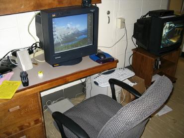 This is my computer, Epsilon before its make over. Big monitor, two speakers. No room for a keyboard on the desk