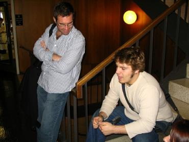 Cole sitting and talking about his show