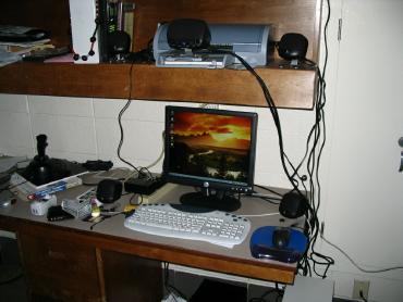 This is Epsilon after. Now it has five speakers and a flat screen monitor. Notice the keyboard on the desk.