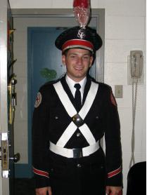 Dan in his marching band Uniform after a game. It took so much work to make him smile like this