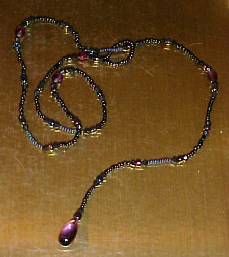 purple and black glass bead lariat