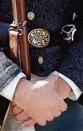 A member wearing the unique belt buckle of thew 6th NC.S.T.