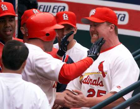 McGwire congratulates Clark on his homer.