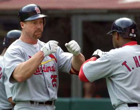 teammate, Thomas Howard, congratulates McGwire after his 60th