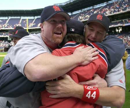 McGwire, La Russa, and Timlin embrace after the sweep