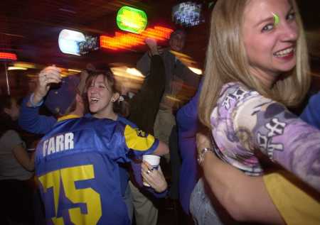 Rams fans celebrate in a bar in St. Louis