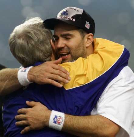Dick Vermeil hugs Kurt Warner