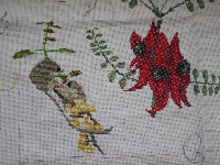 The cross-stitch cushion cover grows