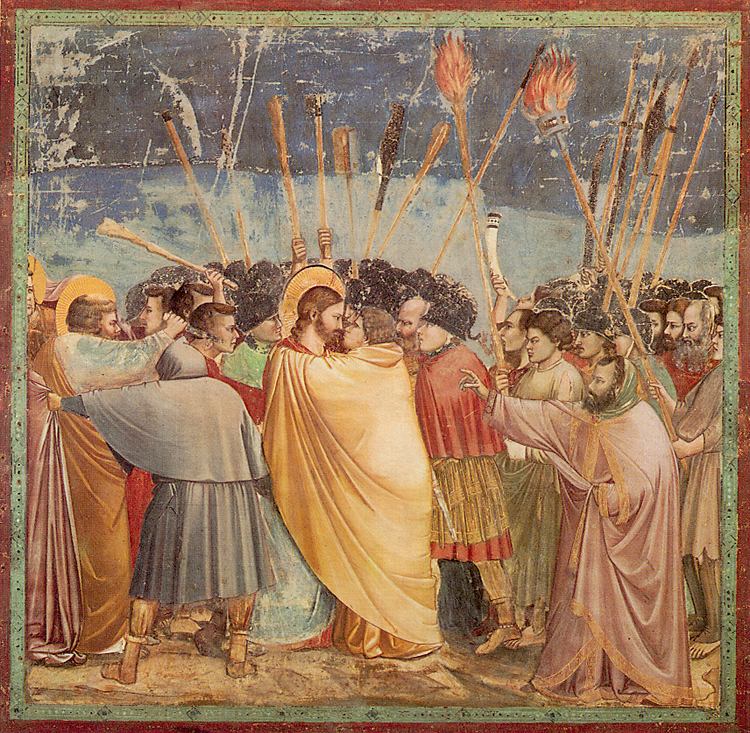  Christ is almost lost from sight in the midst of the mob and all but covered by the yellow robe of the traitor. But He still stands out because of the fiery magnificence of his head. Giotto has given him a noble brow and and a even finer straighter nose than in the other scenes.